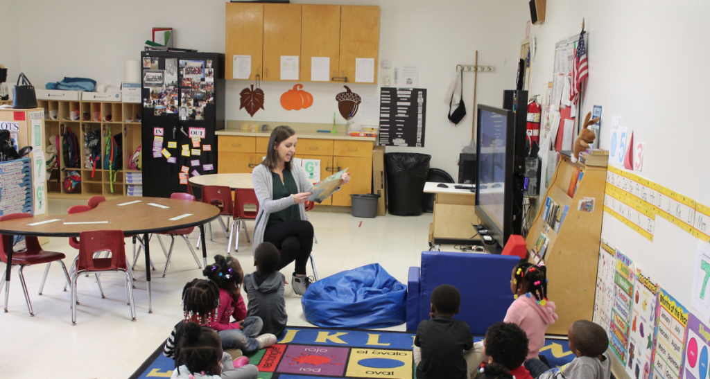 Teacher reading to students at a Water Valley day care center. 